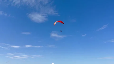 Paraglider Flying Through Clear Blue Sky in 4K 스톡 동영상 337241431