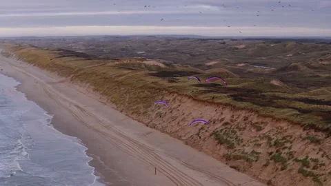 Paraglider Flying Together Over Beach, Netherlands, Aerial Wide Angle Stock Footage 300954980