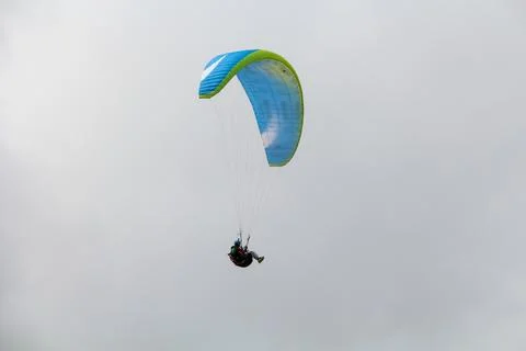Paraglider in front of clouds 4 Stock Photos