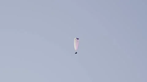 Paraglider in front of sky Stock Footage 260855296