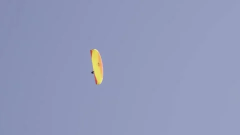 Paraglider in front of sky Stock Footage 260856055