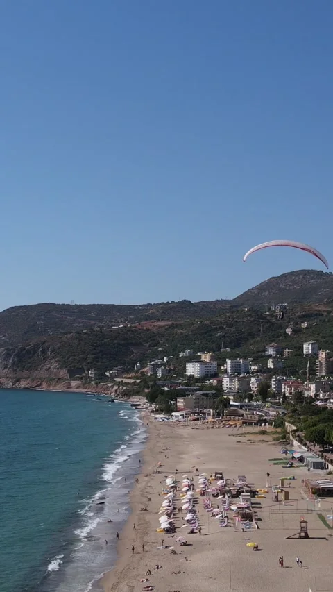 Paraglider Gliding Down To The Beach Stock Footage 295334966
