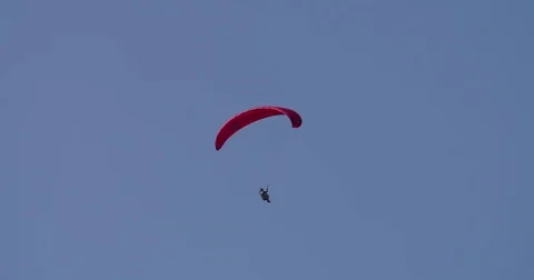 Paraglider gliding in the sky of Austria Stock Footage 79566096