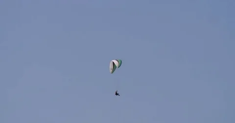 Paraglider gliding in the sky of Austria Stock Footage 79566468