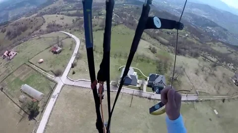 Paraglider has close call with electricty lines during emergency landing Stock Footage 272944468