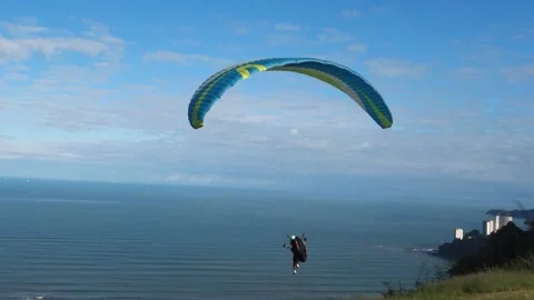 Paraglider jumping from top of hill to start the flight over Brazilian Stock Footage 199378126