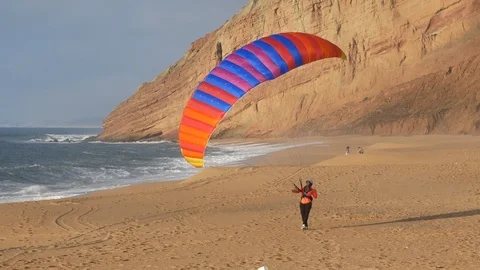 Paraglider Kiting Wing Up the Beach Close Video stock 104872625