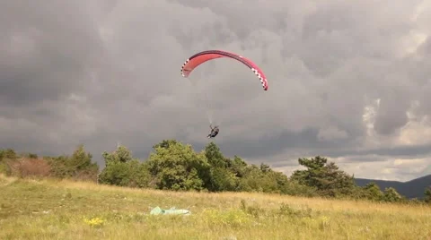 Paraglider landing in a cloudy day Stock-Footage 48001073