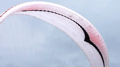 Paraglider landing at field Stock Footage 82655151