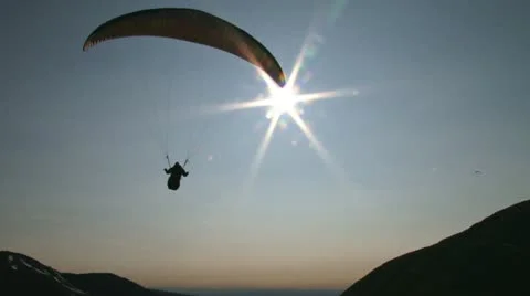 Paraglider in Mountain Sunburst Lens Flare Stock Footage