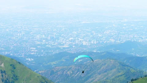 Paraglider in the mountains Stock Footage 331953099
