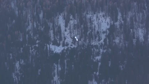 A paraglider in one of the valleys of the Alps. Stock Footage 286345308