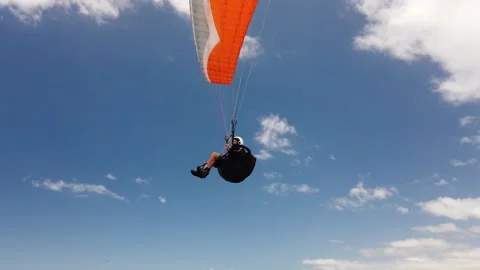 Paraglider over head at the beach Stock Footage 168365141
