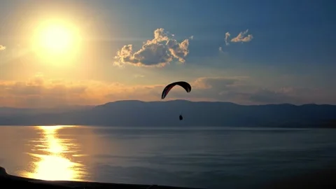 Paraglider Over Ocean at Dusk Stock Footage 310751953
