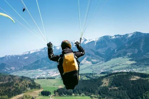 Paraglider is on the paraplane strops - soaring flight moment Stock Photos