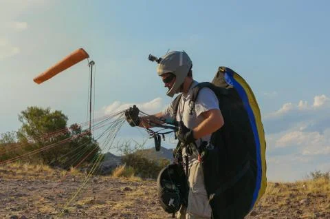 Paraglider pilot assembling equipment Stock Photos