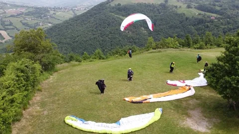 Paraglider ready to fly - Back view of paraglider about to leave the ground Stock Footage 130880707