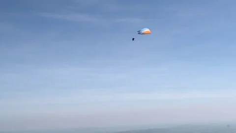 Paraglider sailing down in speed Stock Footage 76004458