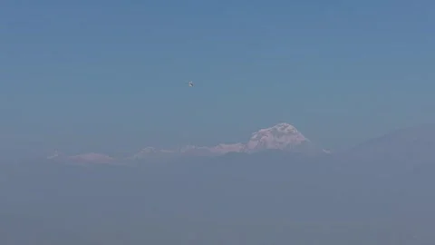 Paraglider Soaring Against Himalayan Mountain Backdrop Stock Footage 337544237