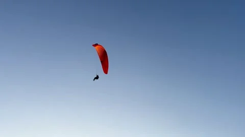 Paraglider Soaring In Clear Blue Sky Video stock 327476036