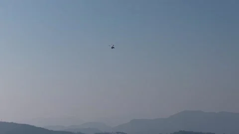 Paraglider Soaring High Above Mountain Landscape Stock Footage 337544555