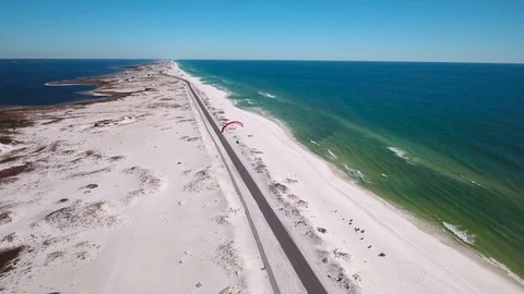 Paraglider soaring over beach Stock Footage 72078006