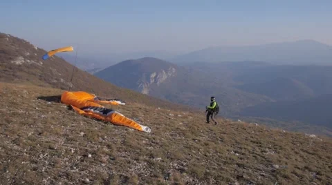 Paraglider Soaring Over The Mountains during sunset Video stock 48846440