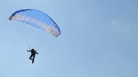 Paraglider soaring in the sky Stock Footage 72771923