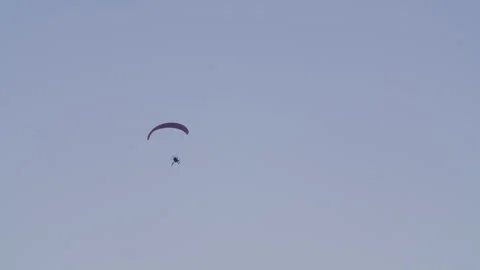 Paraglider Soaring Through the Sky Video stock 302808398