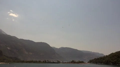 Paraglider soars above open landscape - Paragliding Adventure and Air Sport Stock Footage 339820027