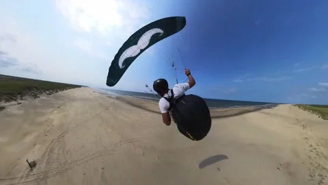 Paraglider Speed Flying Over Beach, On a Sunny Day in Texel Netherlands, Video stock 286406156