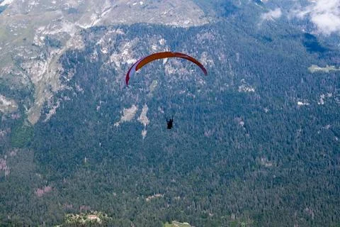 A paraglider starting from the top of the Cima Paganella mountain. Andalo ... Stock Photos
