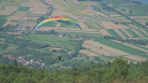 Paraglider Starts Low, Then Rises Over Scenic Landscape Stock Footage 304528665
