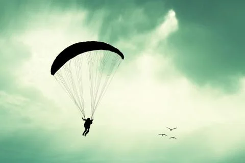 Paraglider at sunset Stock Illustration
