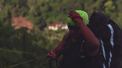 Paraglider takes off Stock Footage 64865392