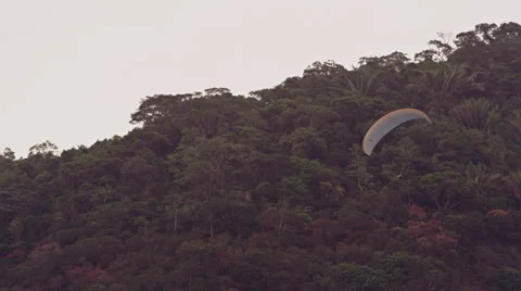 Paraglider takes off in front of spectators Stock Footage 64865440