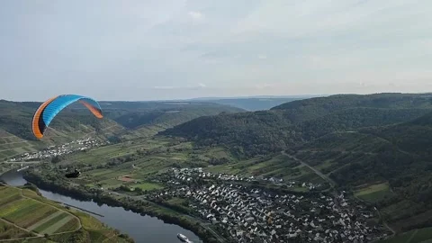Paraglider takes off from a mountain Stock Footage 253310634