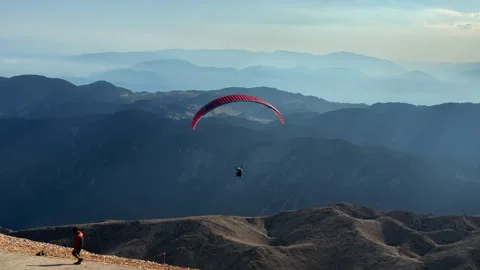 Paraglider takes off from the mountain. Stock Footage 281053945