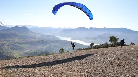 Paraglider taking off from Stock Footage 133648778
