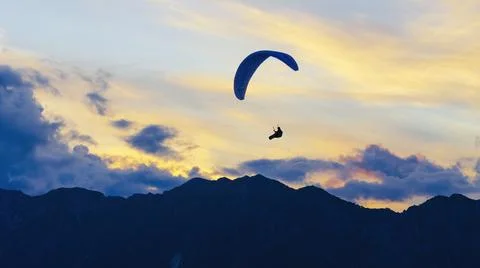 Paraglider wing with sunset clouds 스톡 사진