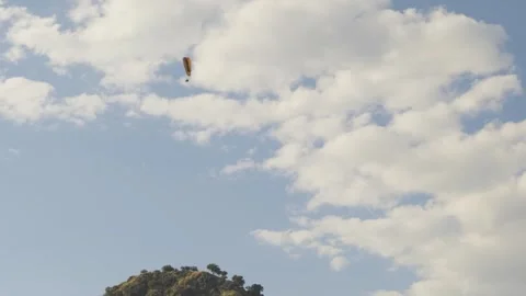 Paragliders in a Clear Blue Sky Stock Footage 282932799
