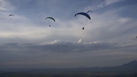 Paragliders in the deep blue sky Stock Footage 83706101