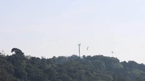 Paragliders Descending Over Forest Stock Footage 292217835