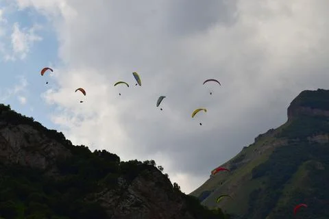 Paragliders in the evening sky Stock Photos