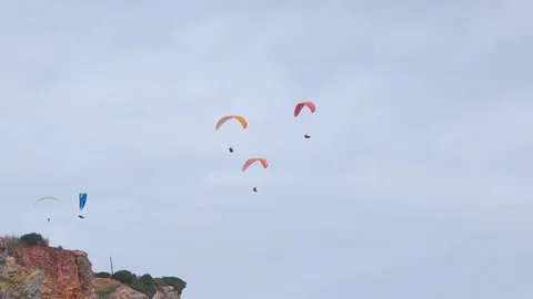 Paragliders Fly Over the Rock Stock Footage 84829061