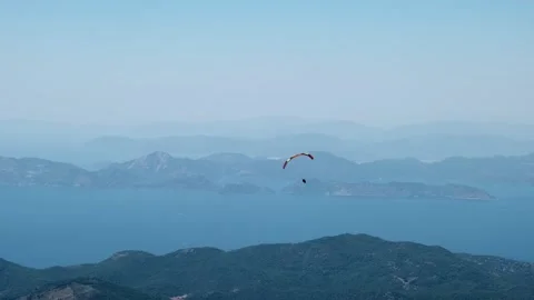 Paragliders fly in the sky Stock Footage 266985533