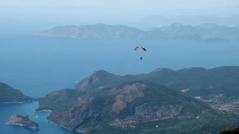 Paragliders fly in the sky Stock Footage 266985659