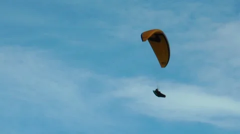 Paragliders flying in the blue cloudy sky. Stock Footage 68725640