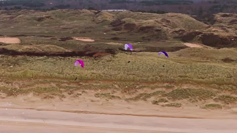 Paragliders Flying Through Huge Flock of Sea Birds, Netherlands Vídeo Stock 300760353
