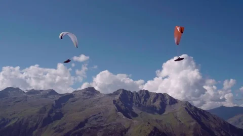 Paragliders gliding in the sky Stock Footage 76140323